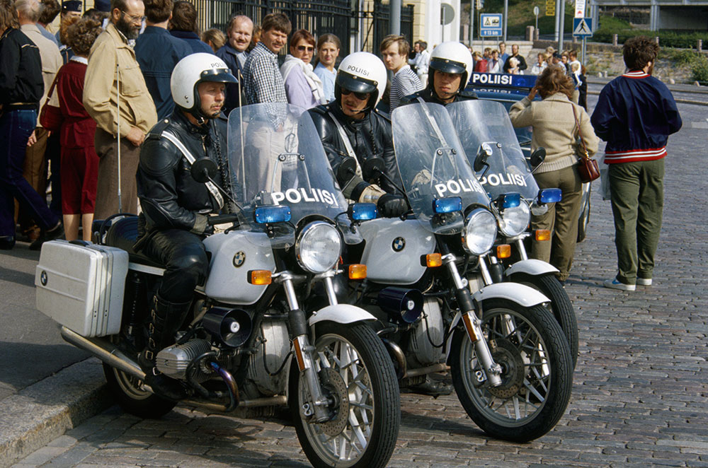 The leather riding suit of motorcycle officers was developed further, and rank insignia were added to the shoulders. Three senior constables on their motorcycles in the 1980s.